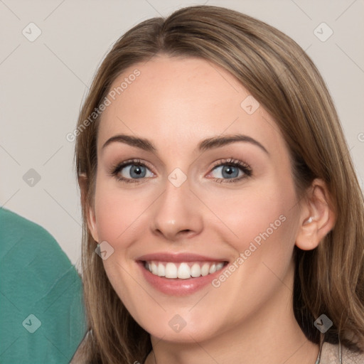 Joyful white young-adult female with long  brown hair and grey eyes