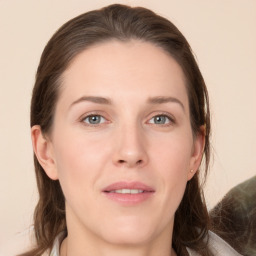 Joyful white young-adult female with medium  brown hair and grey eyes