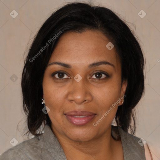 Joyful black adult female with medium  brown hair and brown eyes