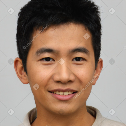 Joyful asian young-adult male with short  black hair and brown eyes