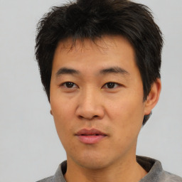 Neutral asian young-adult male with short  brown hair and brown eyes