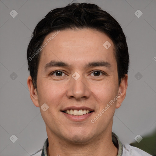 Joyful white young-adult male with short  black hair and brown eyes