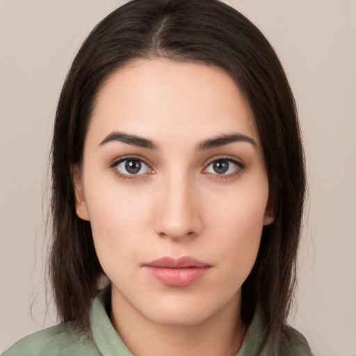 Neutral white young-adult female with medium  brown hair and brown eyes