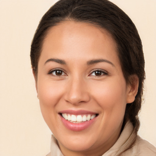 Joyful white young-adult female with medium  brown hair and brown eyes