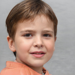 Joyful white child male with short  brown hair and brown eyes