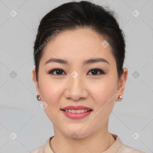 Joyful asian young-adult female with short  brown hair and brown eyes