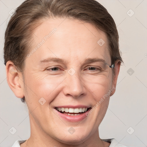 Joyful white adult male with short  brown hair and grey eyes