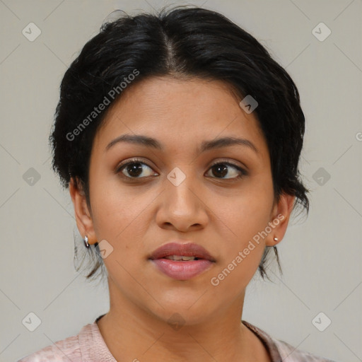 Joyful latino young-adult female with medium  brown hair and brown eyes