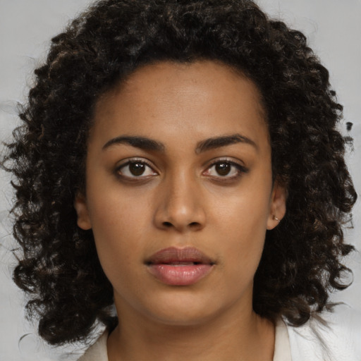 Neutral black young-adult female with medium  brown hair and brown eyes