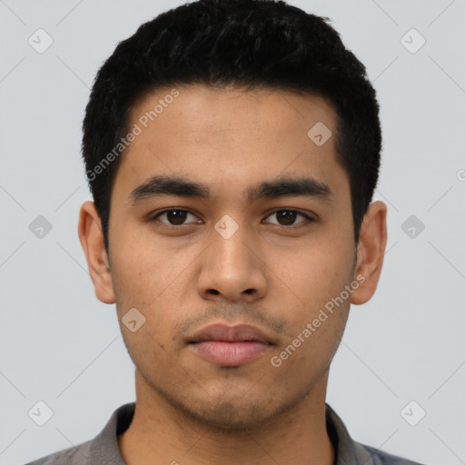 Neutral latino young-adult male with short  black hair and brown eyes