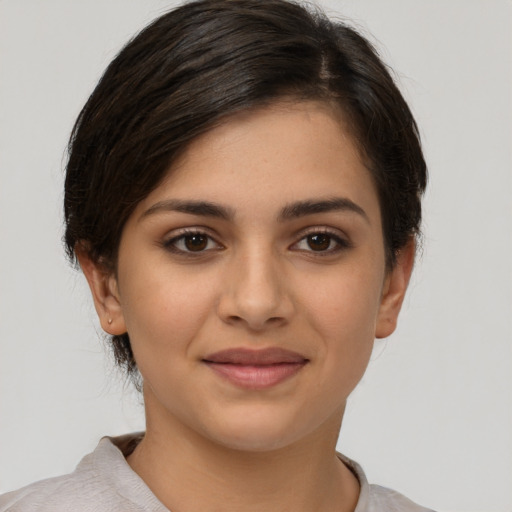 Joyful white young-adult female with short  brown hair and brown eyes