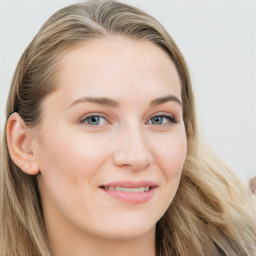 Joyful white young-adult female with long  brown hair and blue eyes