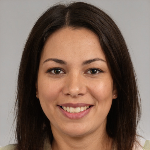 Joyful white young-adult female with medium  brown hair and brown eyes