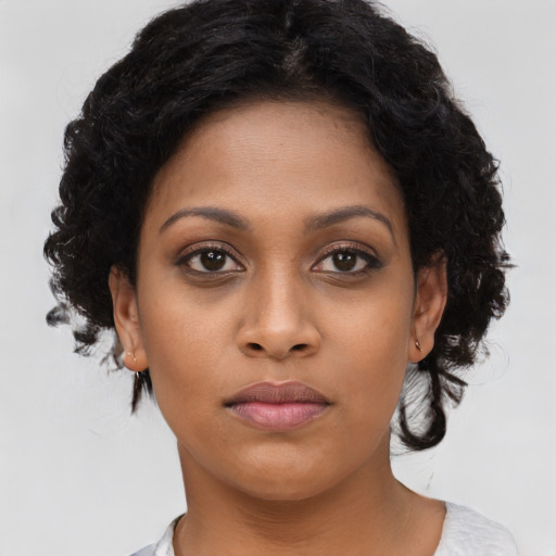 Neutral black young-adult female with medium  black hair and brown eyes
