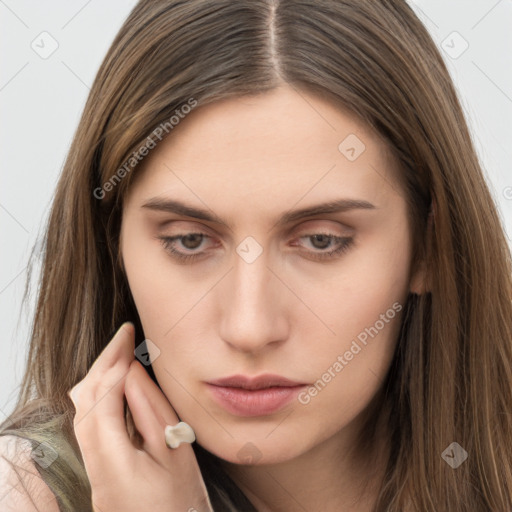 Neutral white young-adult female with long  brown hair and brown eyes