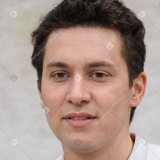 Joyful white adult male with short  brown hair and brown eyes