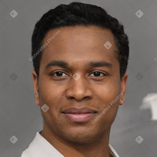 Joyful black young-adult male with short  black hair and brown eyes
