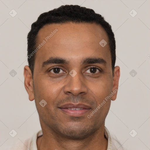 Joyful white young-adult male with short  black hair and brown eyes