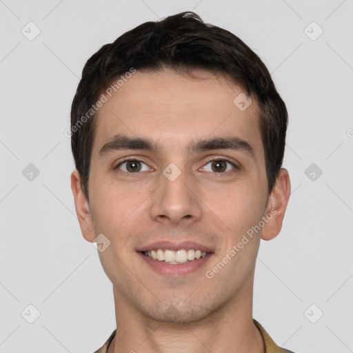 Joyful white young-adult male with short  brown hair and brown eyes