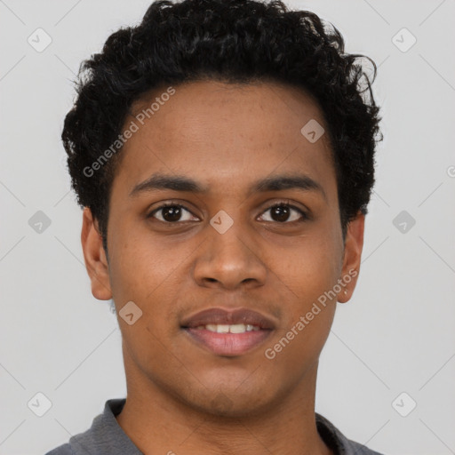 Joyful black young-adult male with short  brown hair and brown eyes