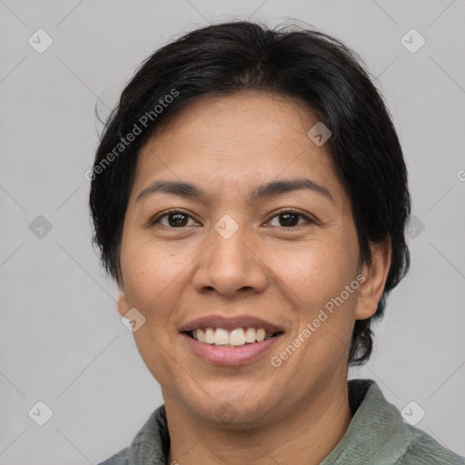 Joyful asian adult female with short  brown hair and brown eyes