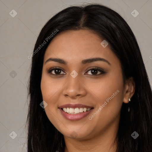 Joyful latino young-adult female with long  brown hair and brown eyes