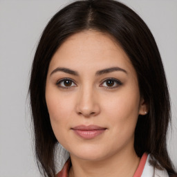 Joyful white young-adult female with medium  brown hair and brown eyes