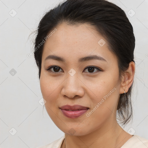 Joyful asian young-adult female with medium  brown hair and brown eyes