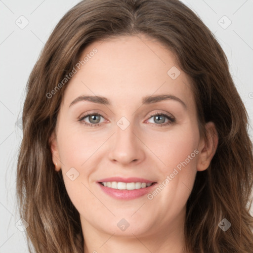 Joyful white young-adult female with long  brown hair and green eyes