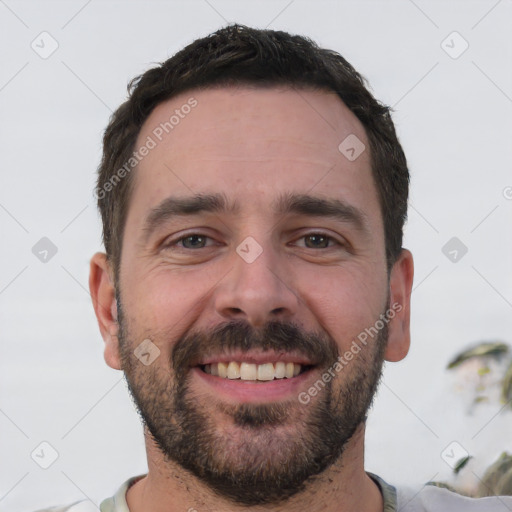 Joyful white young-adult male with short  black hair and brown eyes