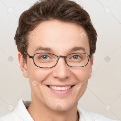 Joyful white adult male with short  brown hair and grey eyes