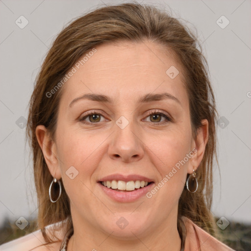 Joyful white adult female with medium  brown hair and grey eyes