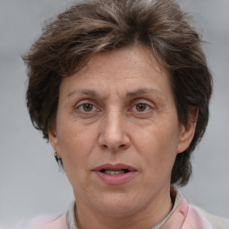 Joyful white adult female with short  brown hair and brown eyes