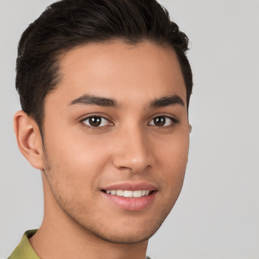 Joyful white young-adult male with short  brown hair and brown eyes