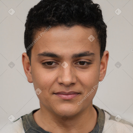 Joyful latino young-adult male with short  brown hair and brown eyes