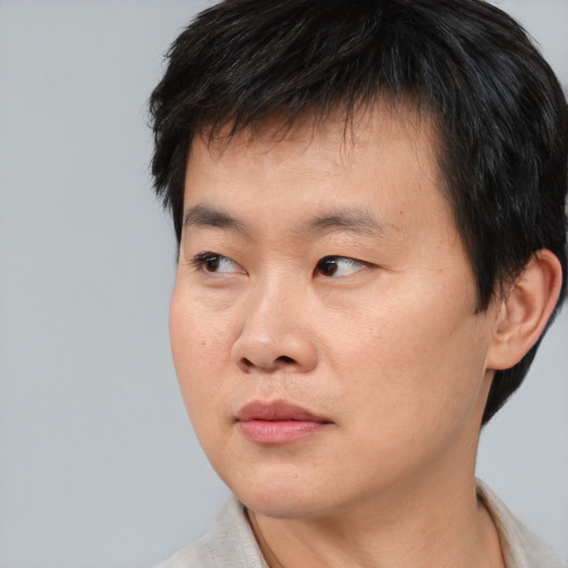 Neutral asian young-adult male with short  black hair and brown eyes