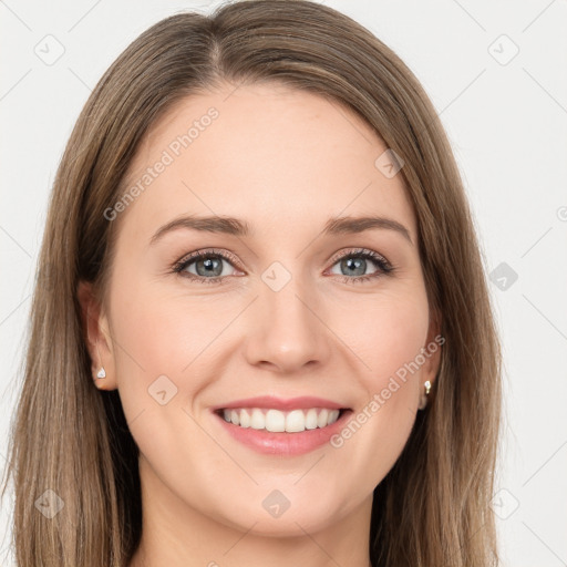 Joyful white young-adult female with long  brown hair and green eyes