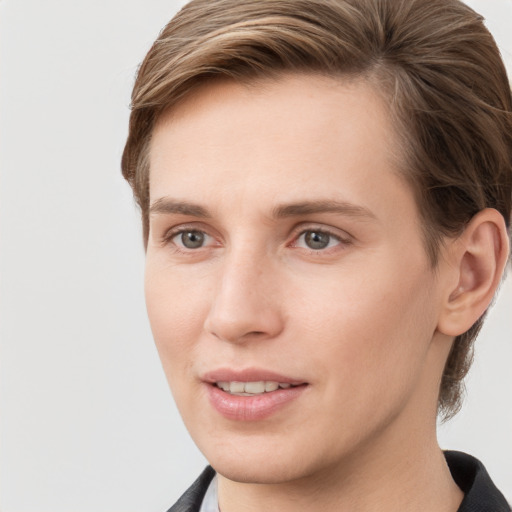 Joyful white young-adult female with short  brown hair and grey eyes