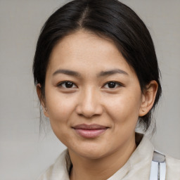 Joyful asian young-adult female with medium  brown hair and brown eyes