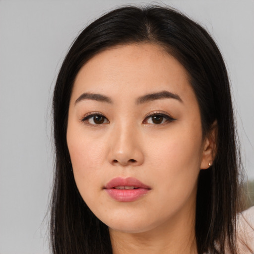 Neutral asian young-adult female with long  brown hair and brown eyes