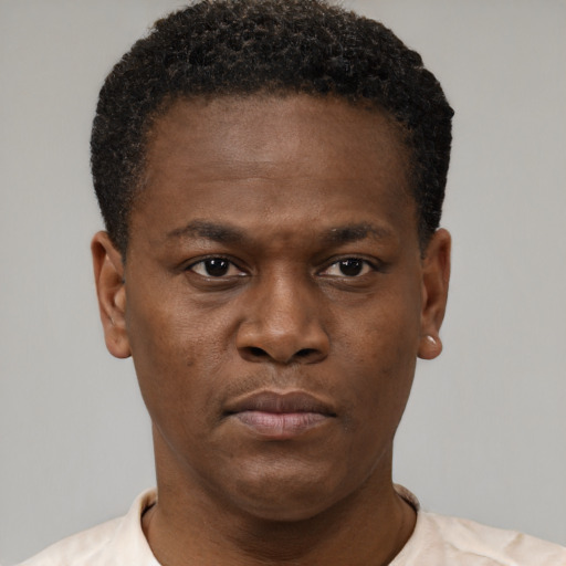 Neutral black young-adult male with short  brown hair and brown eyes