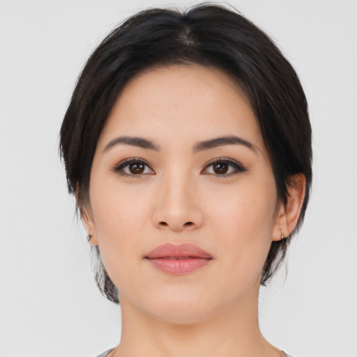 Joyful asian young-adult female with medium  black hair and brown eyes