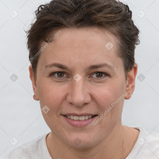 Joyful white adult female with short  brown hair and brown eyes