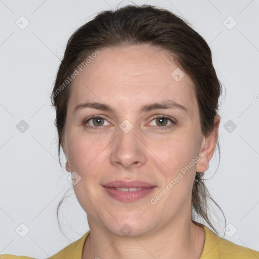 Joyful white adult female with medium  brown hair and grey eyes