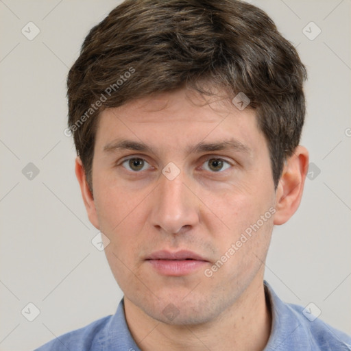 Neutral white young-adult male with short  brown hair and grey eyes