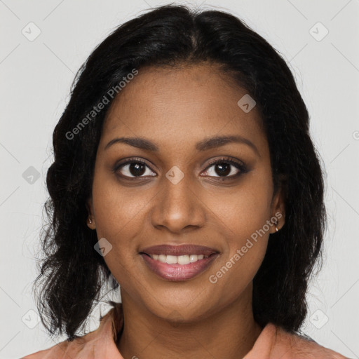 Joyful black young-adult female with long  brown hair and brown eyes