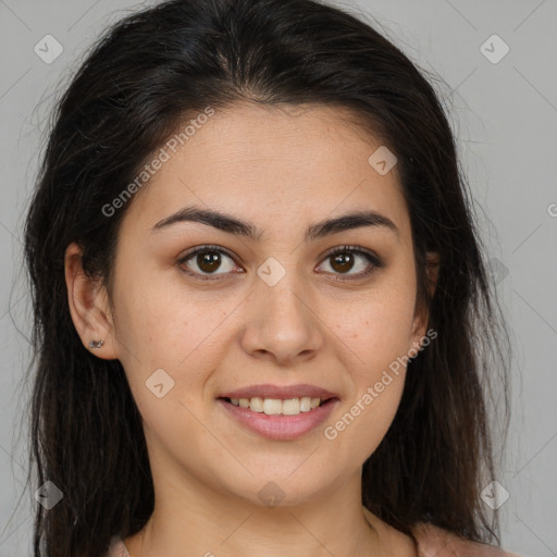 Joyful latino young-adult female with long  brown hair and brown eyes