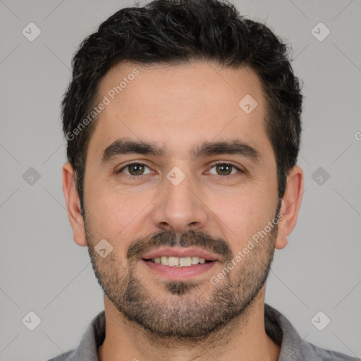 Joyful white young-adult male with short  black hair and brown eyes