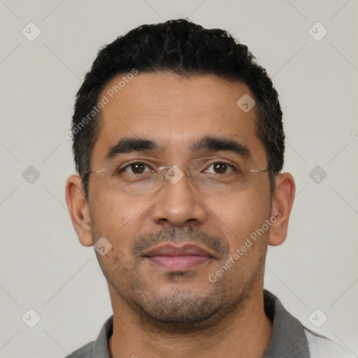 Neutral latino young-adult male with short  black hair and brown eyes