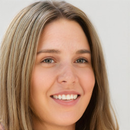 Joyful white young-adult female with long  brown hair and green eyes